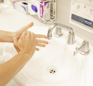 Woman%20washing%20hands%20in%20a%20sink