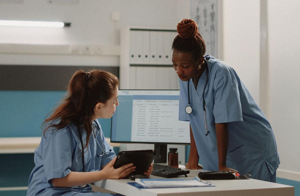 Two doctors looking at a patients chart in a clinic.