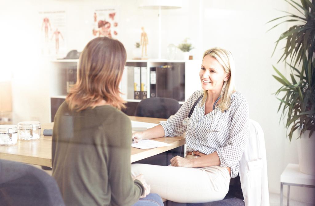 Doctor meeting with patient.