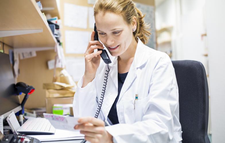 pharmacist talking on phone