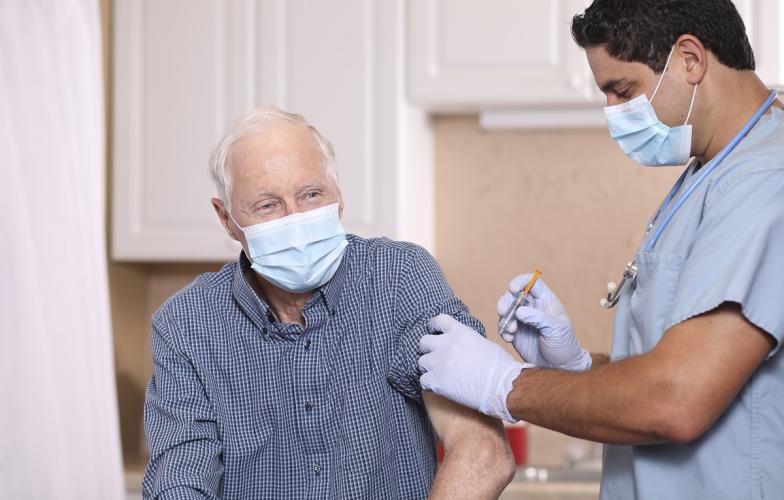 Elderly man receiving flu vaccine 