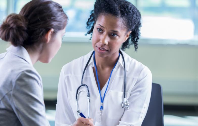 Physician attentively listening to patient