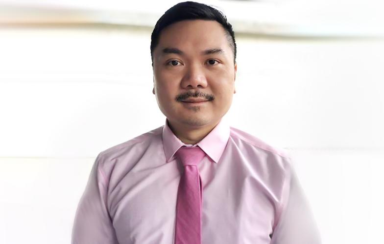 Dr Matthew Chow wearing pink for Pink Shirt Day 