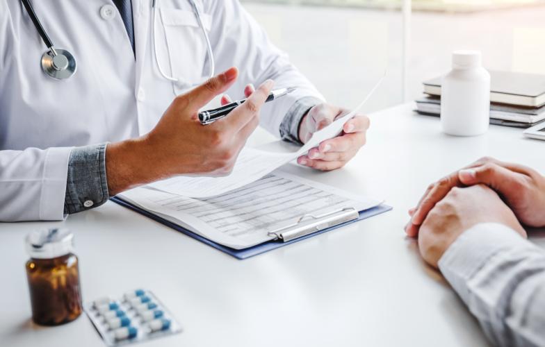 Doctor at desk with patient