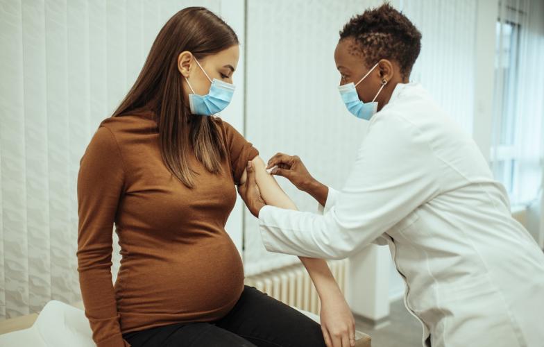 Pregnant woman receiving COVID vaccine 