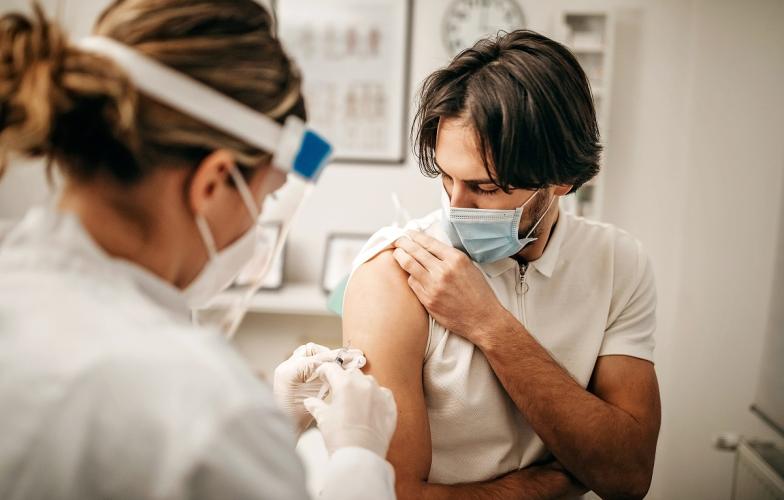Young man receiving vaccine