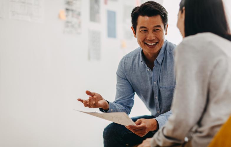 Man mentoring young woman 