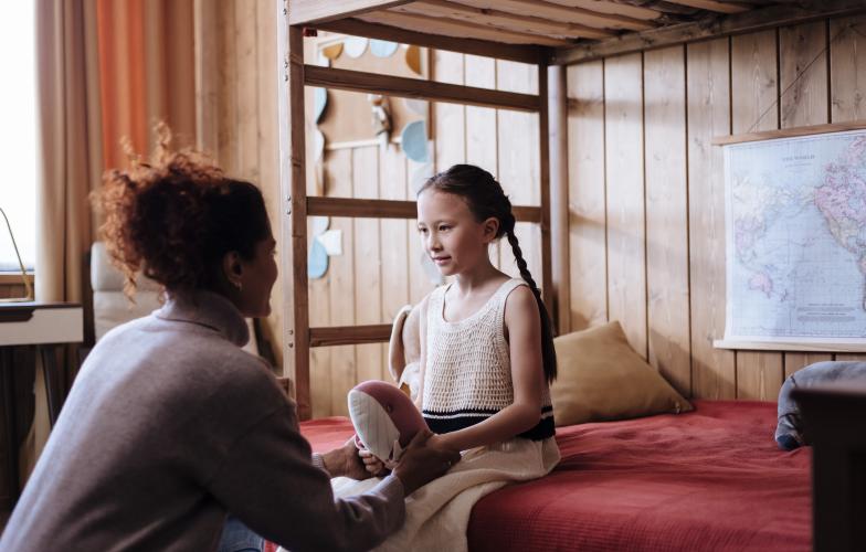Mother speaking to her daughter