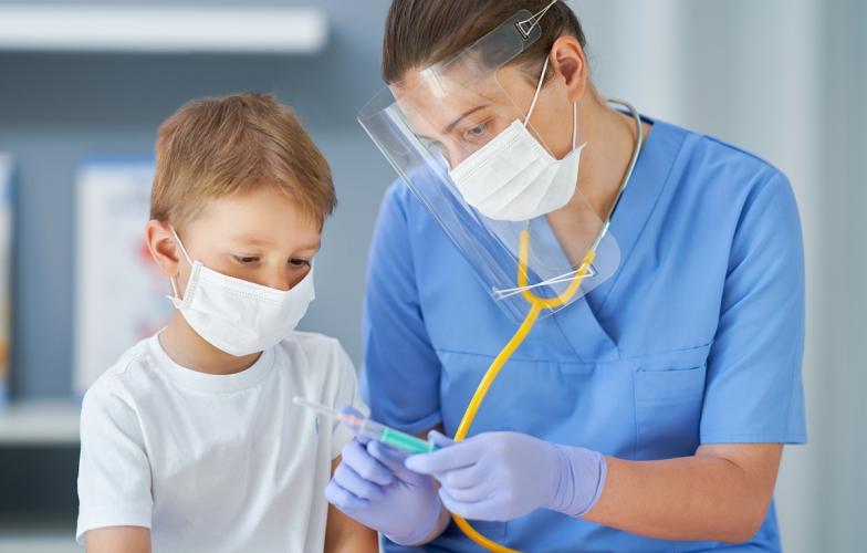 child_receiving_covid_shot.jpg