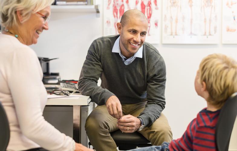 young_physician_doctor_with_grandmother_and_child_in_clinic_office_stock_photography_id_310330.jpg