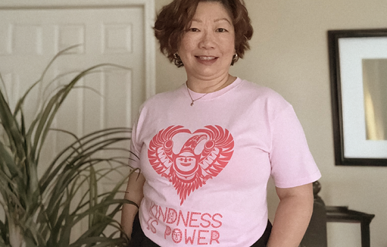 Dr Charlene Lui wearing pink shirt and smiling for Pink Shirt Day.