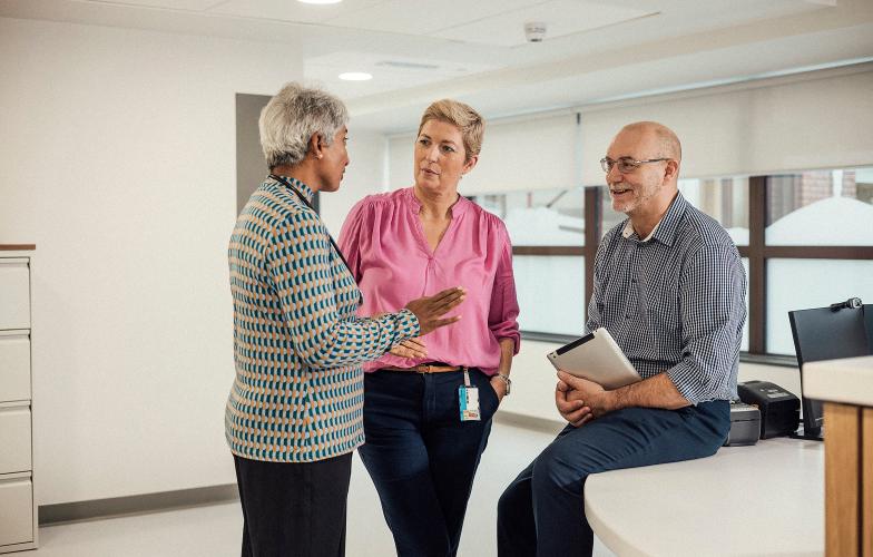 Healthcare professionals talking in office.