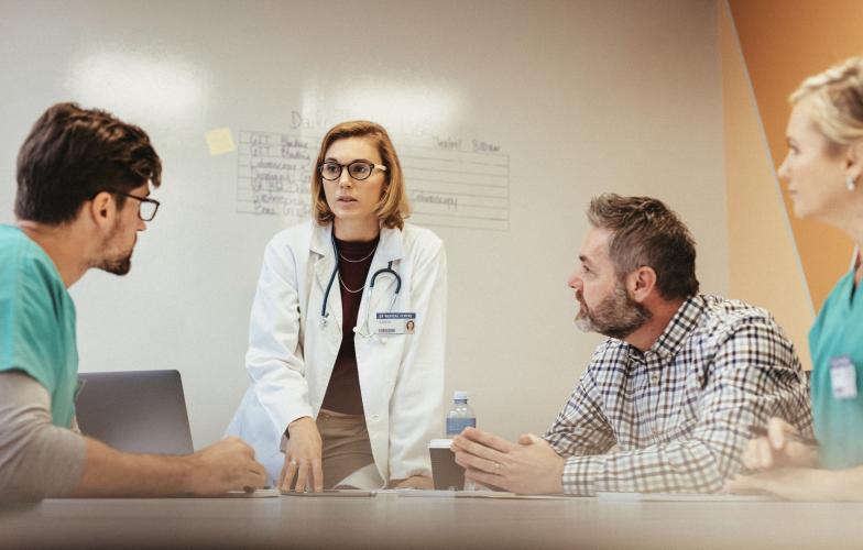 Medical team meeting at table