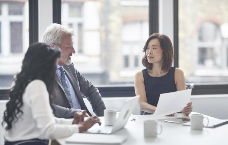 three_people_discussing_business_committee_istock_id_303845.jpg