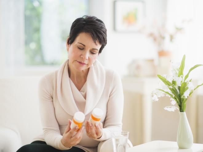 Woman holding medication 