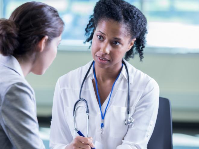 Physician attentively listening to patient