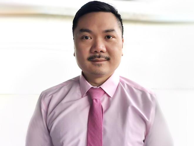Dr Matthew Chow wearing pink for Pink Shirt Day 