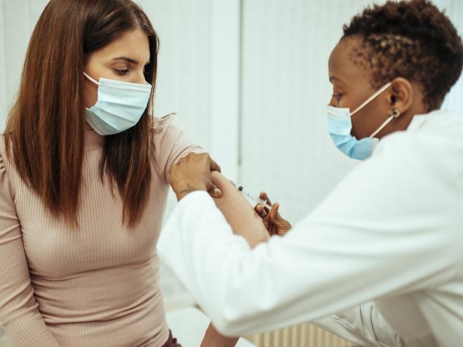 Young woman getting COVID-19 vaccine