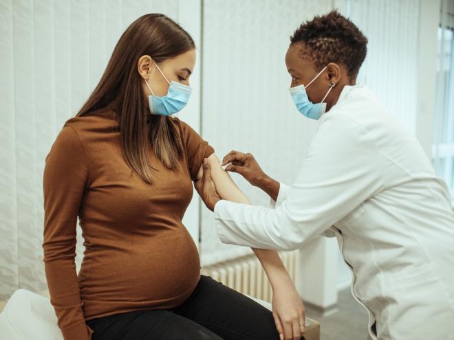 Pregnant woman receiving COVID vaccine 