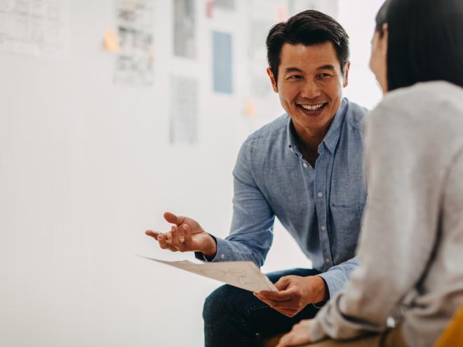 Man mentoring young woman 