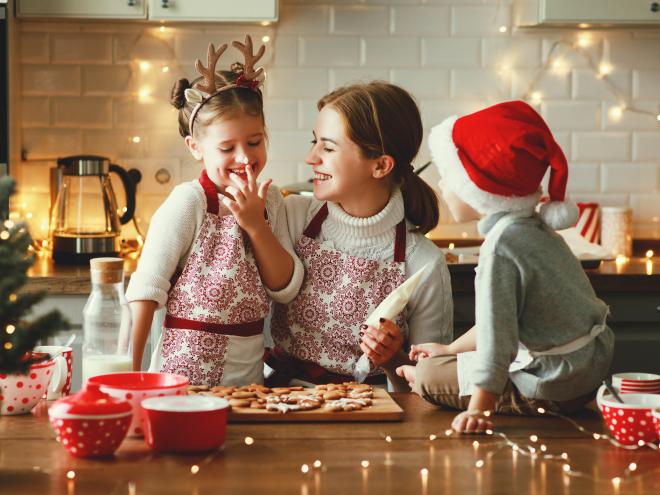 Family making holiday cookies together 