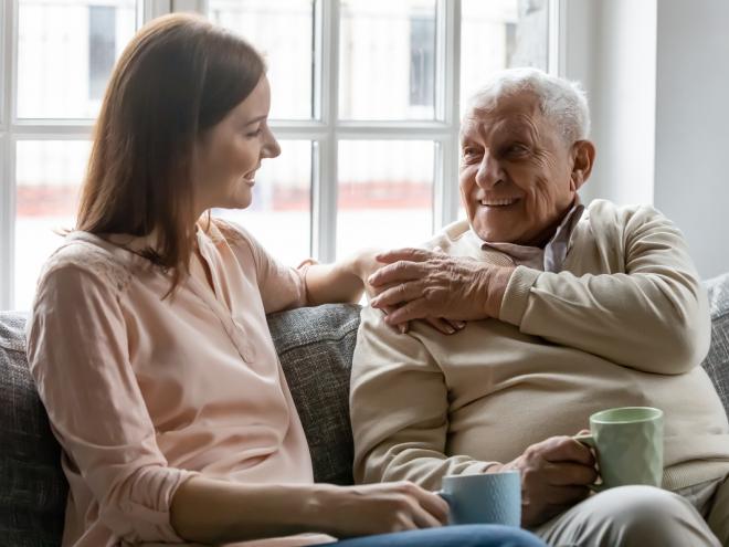 Young woman chatting with her father