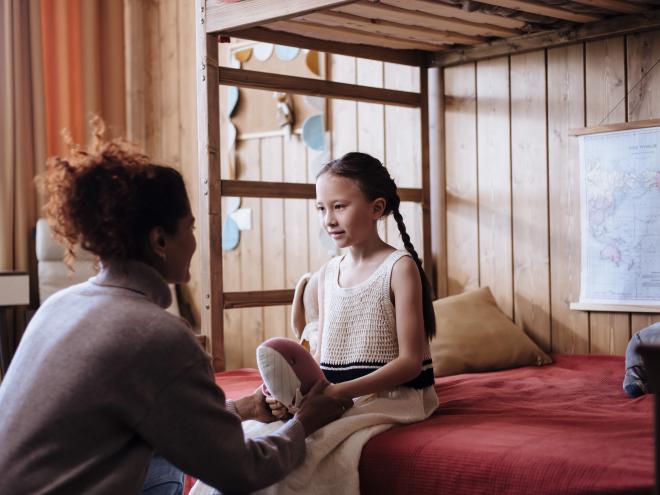 Mother speaking to her daughter