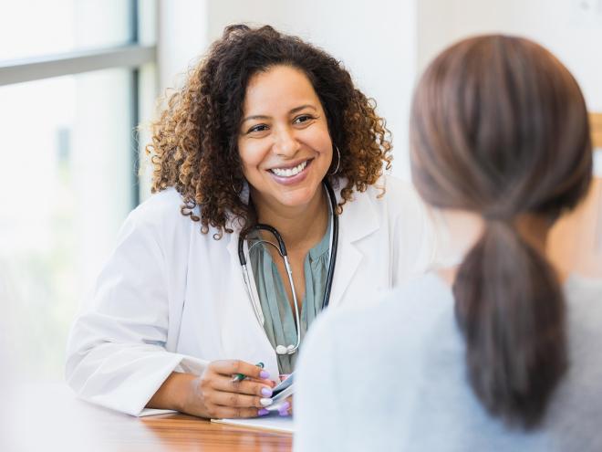 Physician speaking to patient 