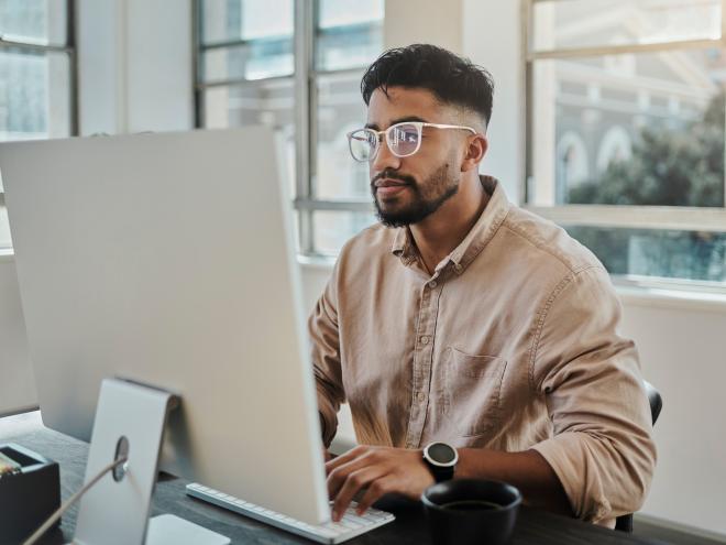 person_working_on_computer_at_desk.jpg