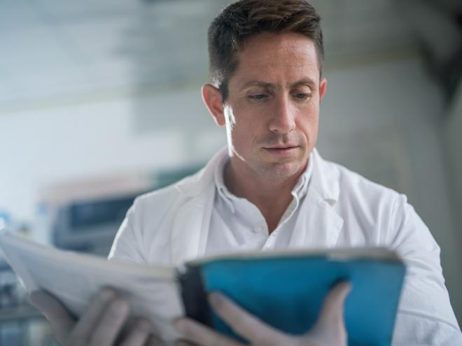 physician_doctor_reading_book_stock_photo_id_112750.jpg