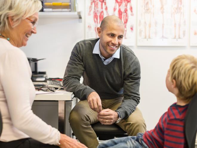 young_physician_doctor_with_grandmother_and_child_in_clinic_office_stock_photography_id_310330.jpg