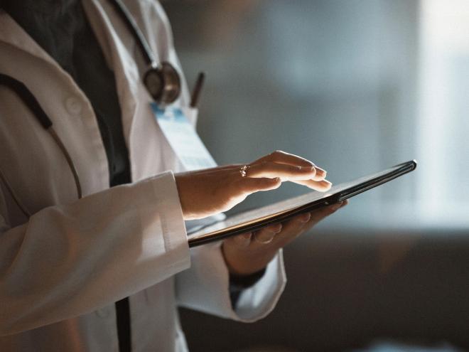 Doctor working on an ipad.