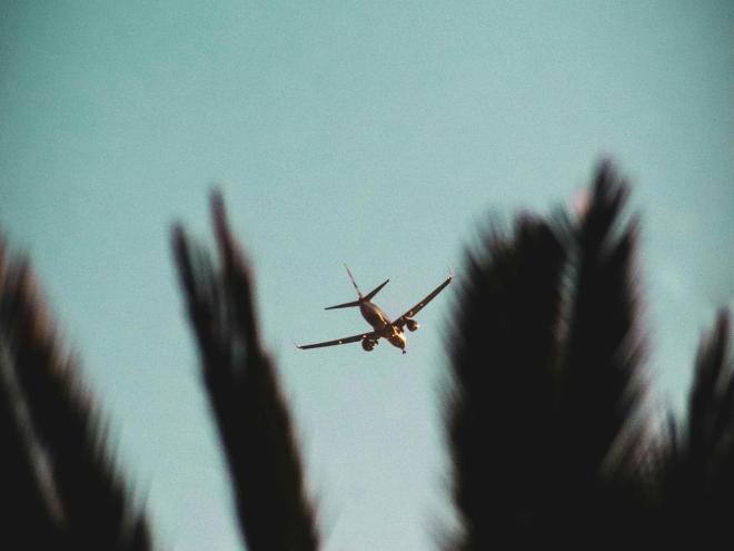 A plane travelling through the sky.