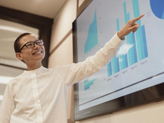 pay-person-pointing-at-presentation-slide.jpg
