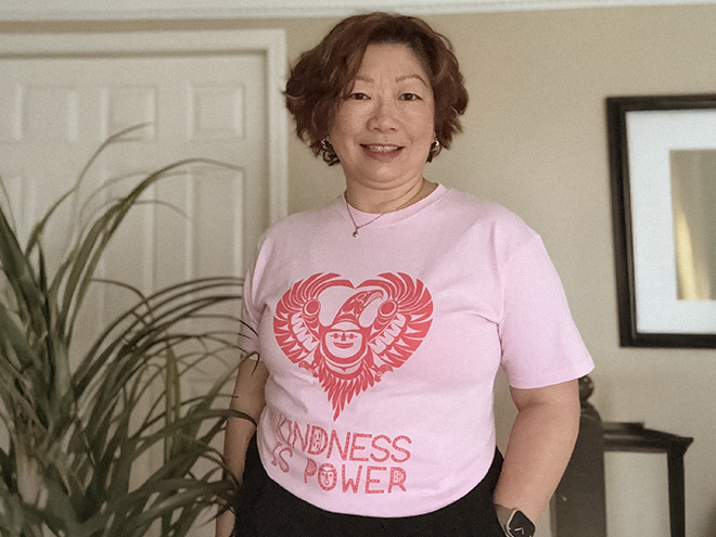 Dr Charlene Lui wearing pink shirt and smiling for Pink Shirt Day.