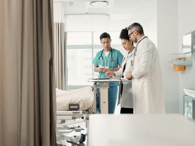 Doctors in hospital room.