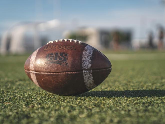 Close up of football on field.