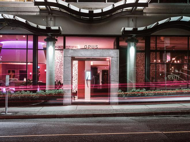 An exterior street view of an Opus hotel in Vancouver