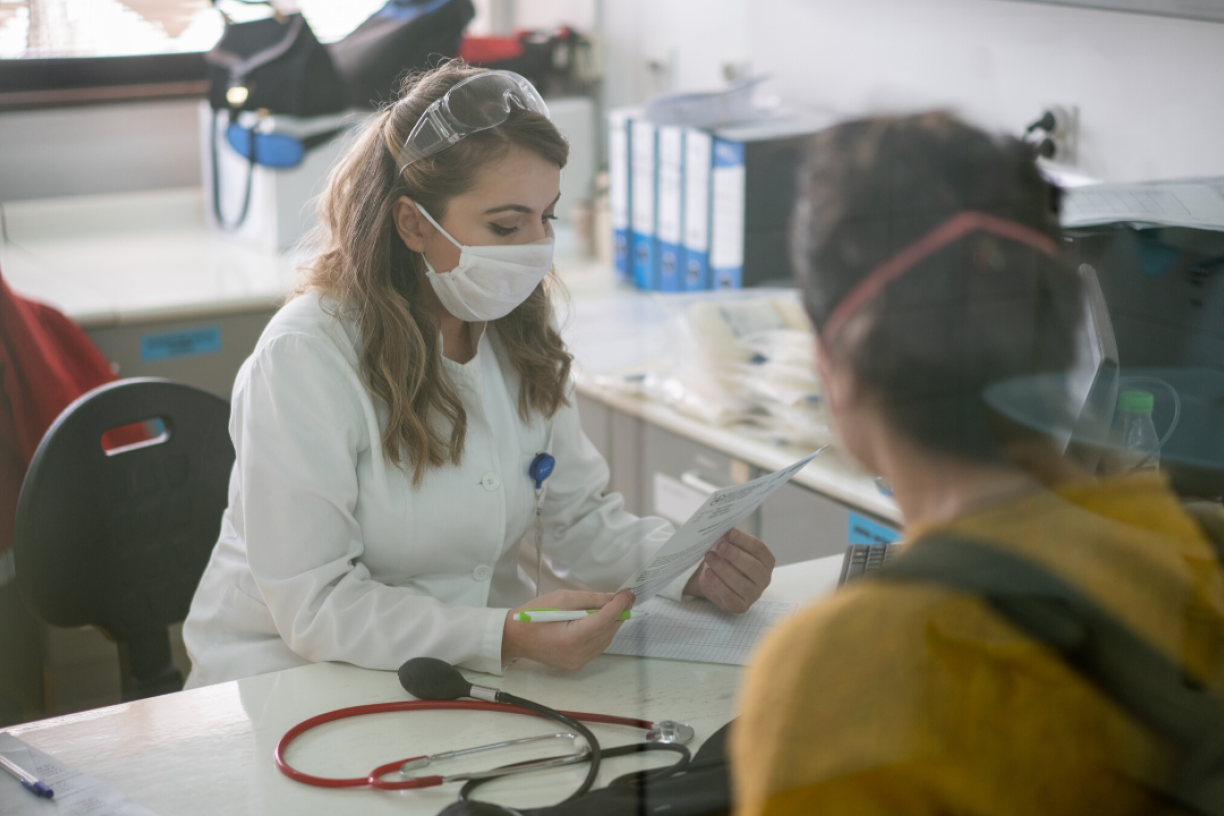 Doctor wearing mask in office