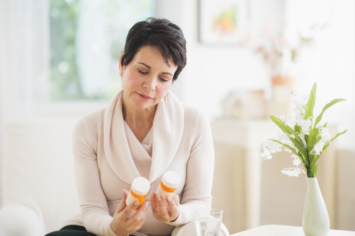 Woman holding medication 