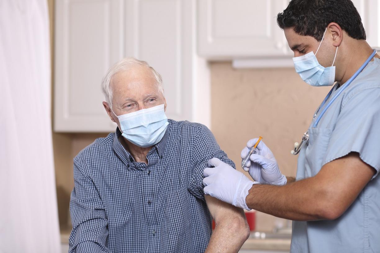 Elderly man receiving flu vaccine 
