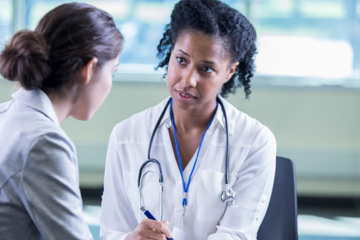 Physician attentively listening to patient