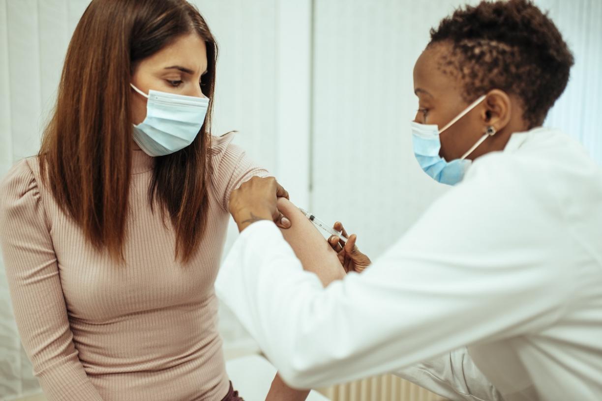 Young woman getting COVID-19 vaccine