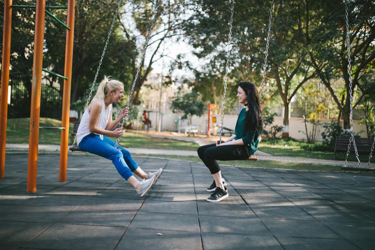 Friends laughing in a park