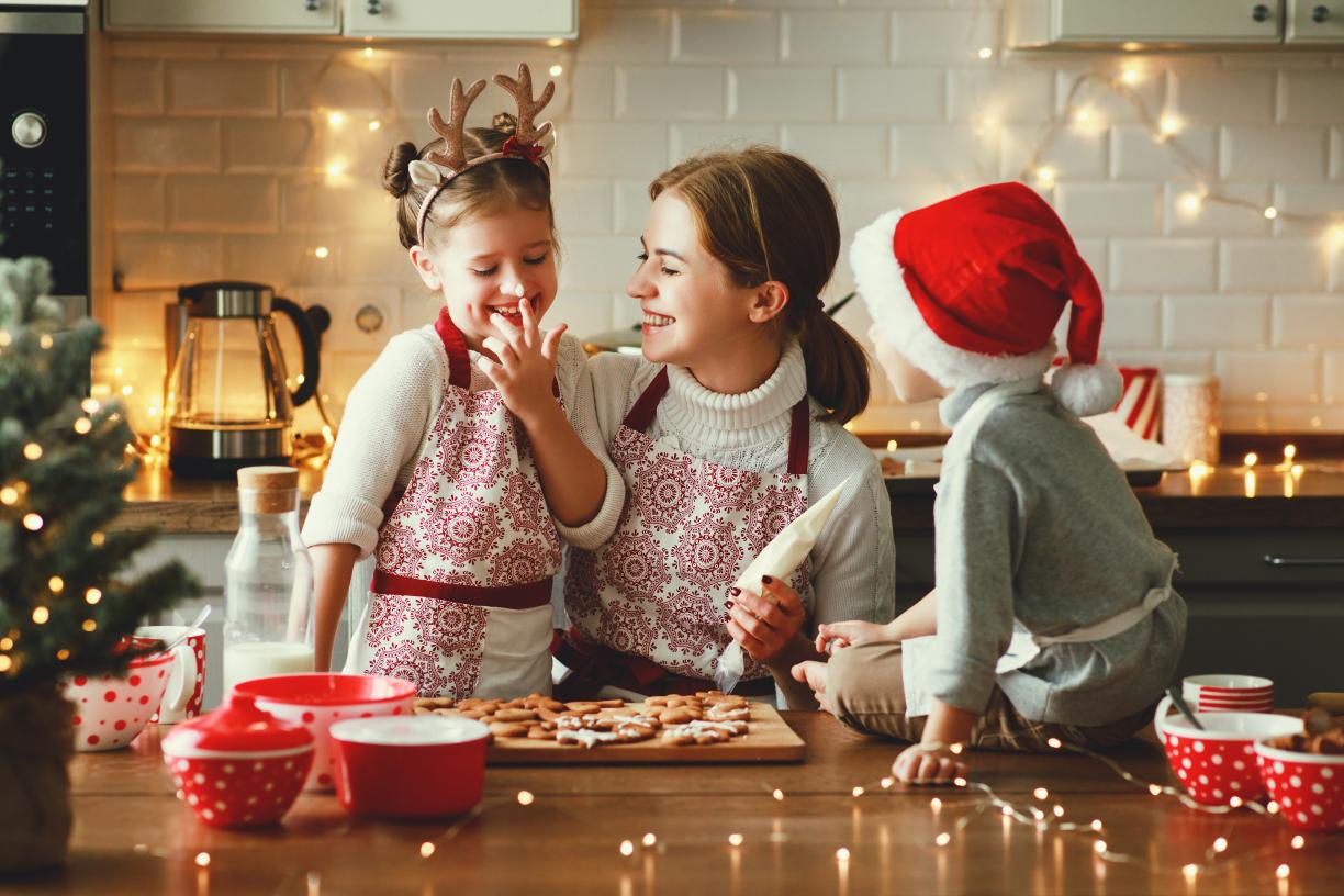 Family making holiday cookies together 
