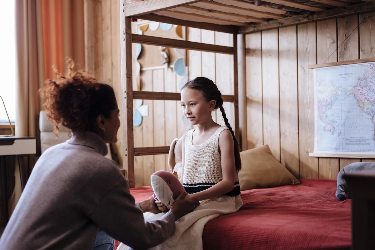 Mother speaking to her daughter