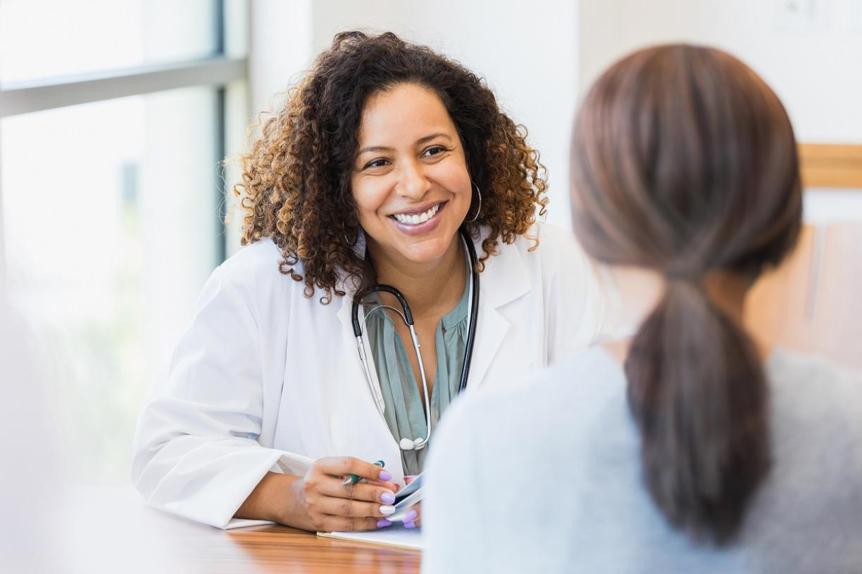 Physician speaking to patient 