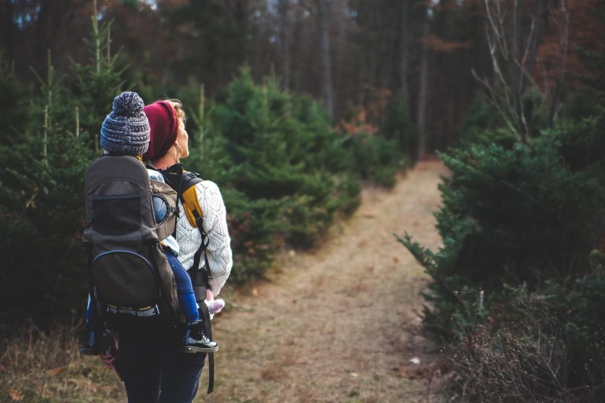 Woman and child hiking in the forest 
