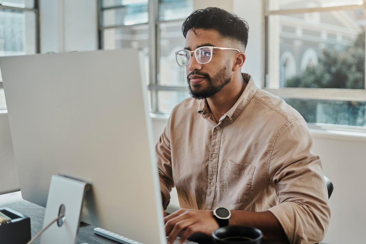 person_working_on_computer_at_desk.jpg