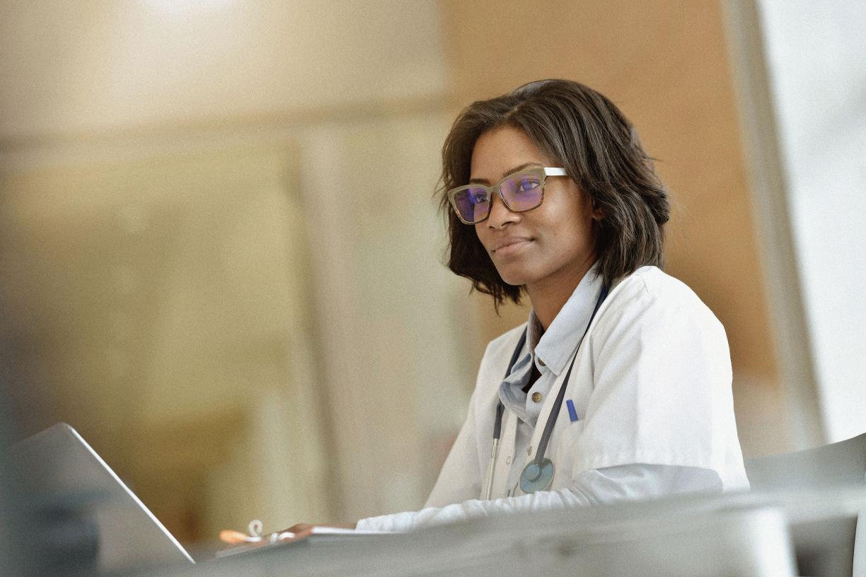 A doctor looking at their laptop. 